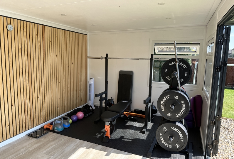 Gym Studio with rear oak feature wall in West Sussex