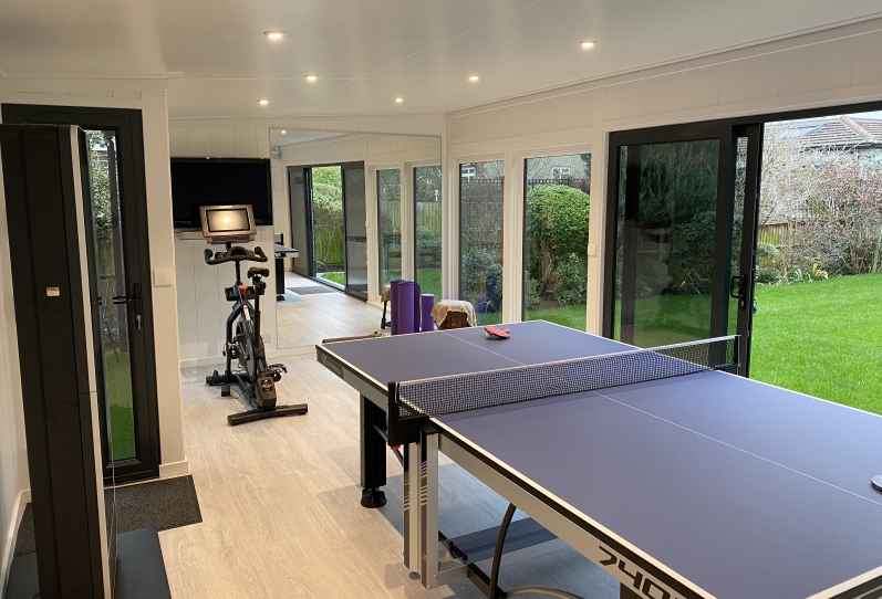 Bespoke French door, games room and gym,mirrors  L-shaped at rear in london