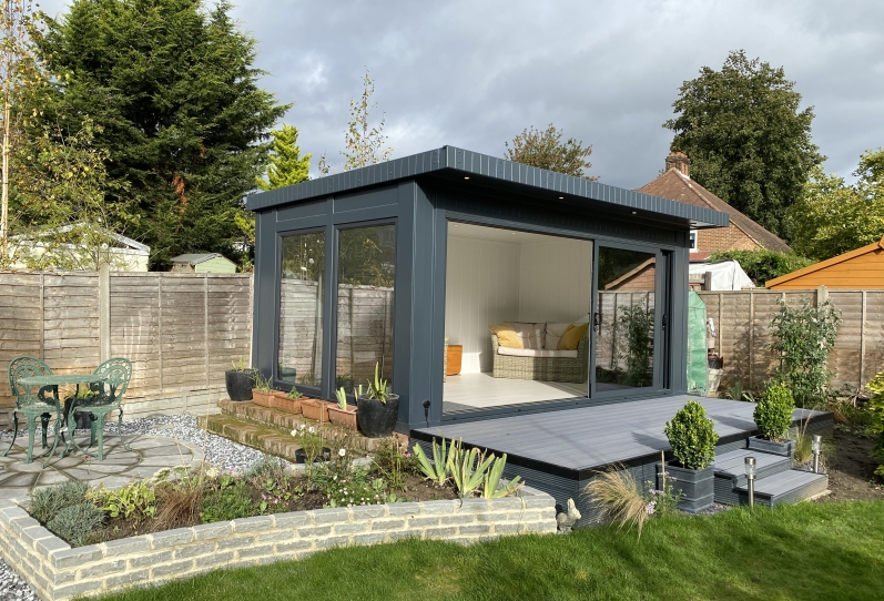 tri-sliding garden summerhouse and reading room with composite decking Bromley Kent