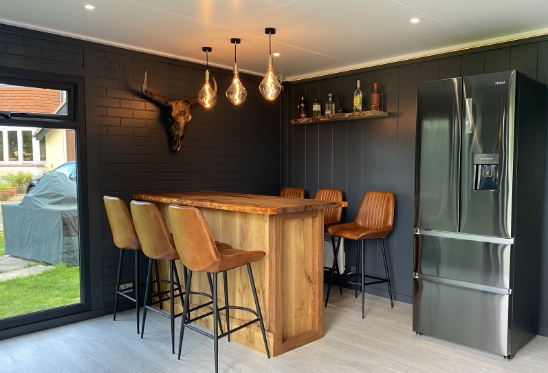 Garden bar with feature walls and lighting interior design in Surrey