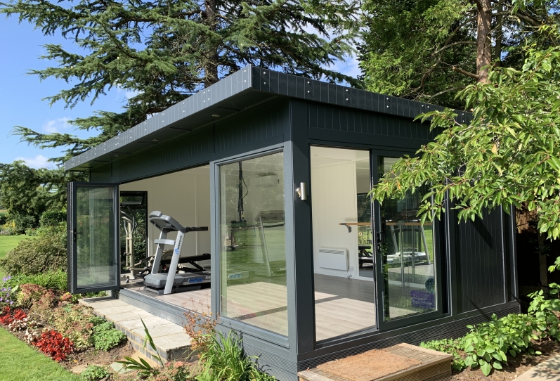 Bi-fold gym with side siding access door in hampshire