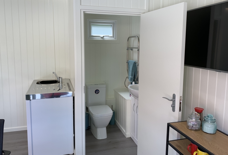 toilet and elfin kitchenette  in a summer house Surrey