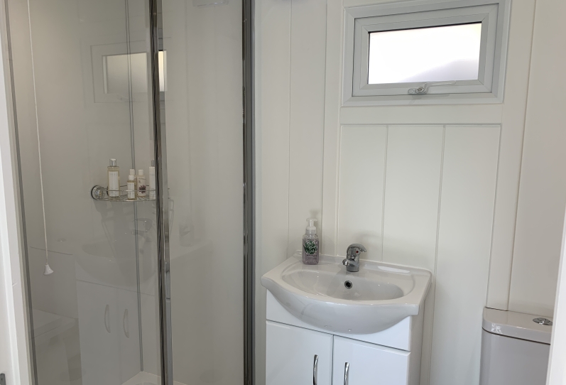 Aluminium in-line slider with canopy and hot tub featuring 'Starlight Ceiling' West Sussex Internal Bathroom and Shower