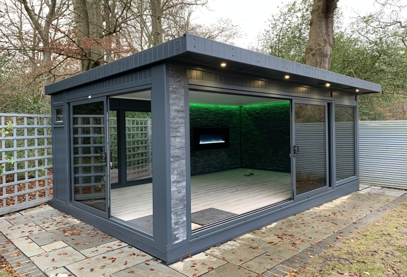 Ultimate Garden Office with Split face tiling inside and out, feature wall fireplace Bromley