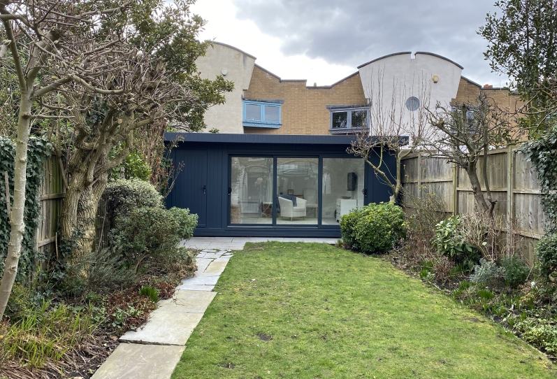 Garden Room Lounge with Tri-Sliding Doors and Roof Lights London