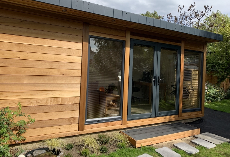 Cedar garden room with anthracite doors, windows and Fascia  Epsom Surrey