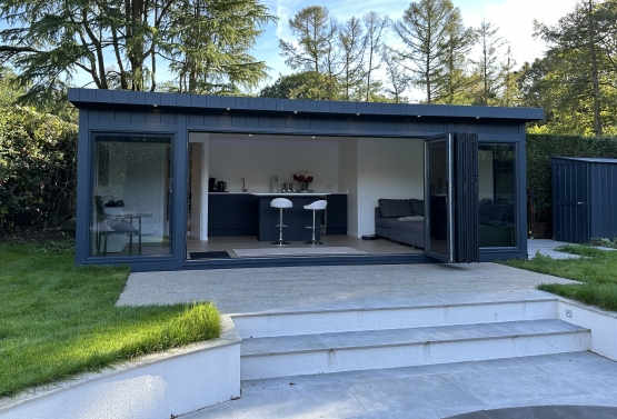 bespoke pool-side room with bi-fold doors and bar in Oxforshire
