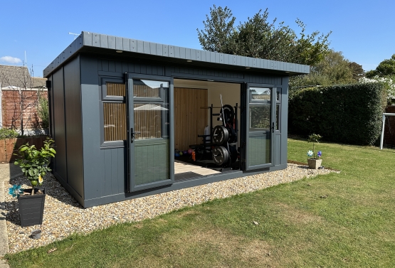 garden, gym with rear feature wall in west Sussex