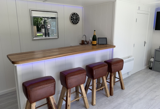 garden summerhouse entertainment room  with bar and shower room in Sussex