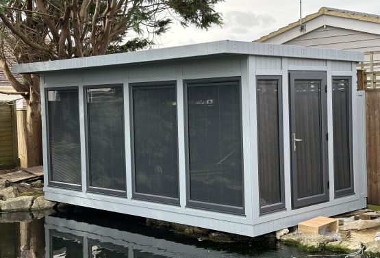 cantilevered summerhouse with integrated blinds in Sussex